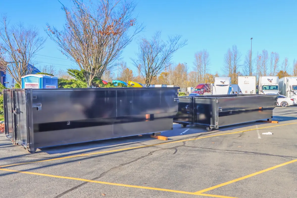 Professional dumpster rental service with roll-off container on residential driveway in Vero Beach South